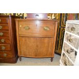 A George III mahogany and inlaid commode `