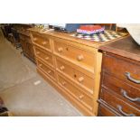 A large stripped pine six drawer chest