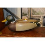 A modern painted wooden decoy duck