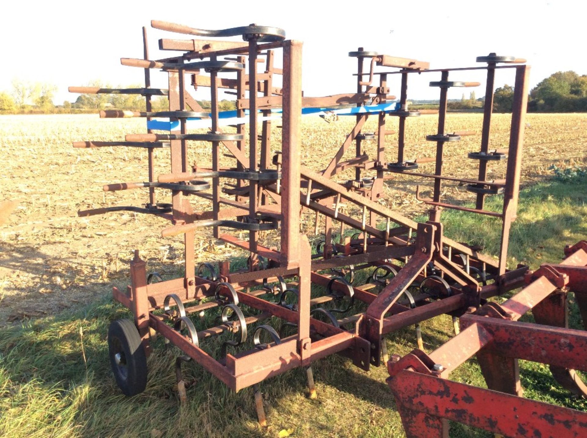 Manual fold spring tines with following harrow.