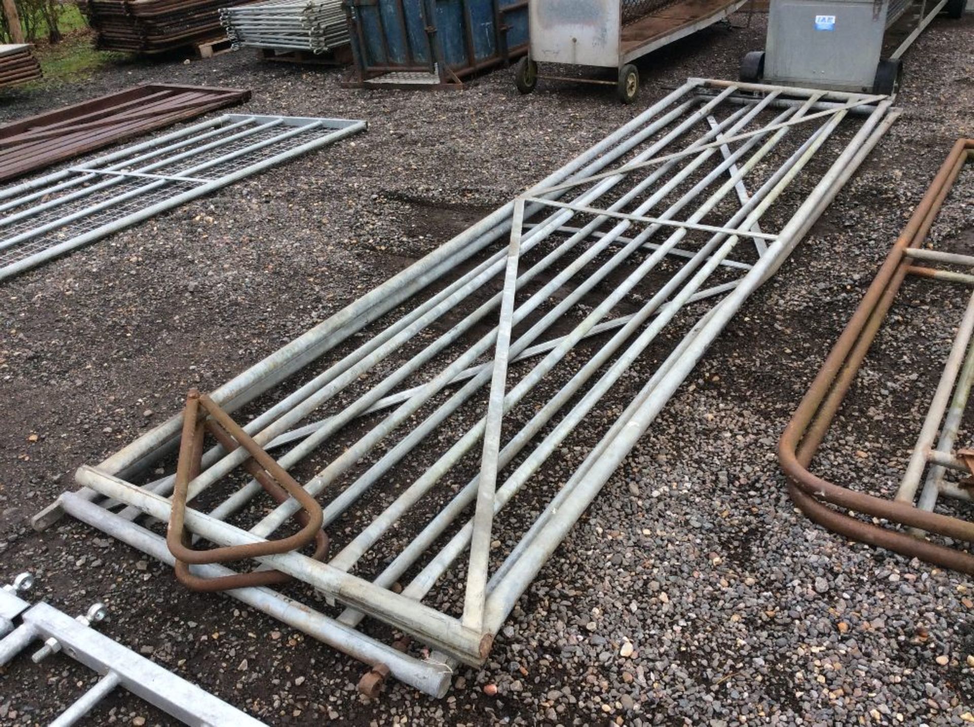 Pair of 15ft heavy metal yard gates with overlatch.