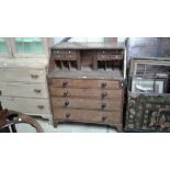 An 18th Century oak bureau fitted four long drawer