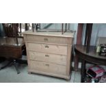 A continental stripped pine chest fitted four long