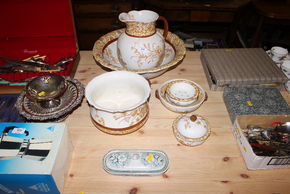 An Edwardian floral decorated wash set and soap di