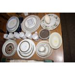 A quantity of various dinner plates to include Roy