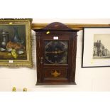 An early 20th Century mahogany cased wall clock