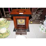 A mahogany and inlaid table clock polyphon