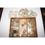 A tray of coinage and bank notes