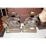A pair of heavy cast iron door stops in the form o
