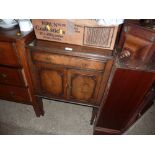 A mahogany two door side cupboard fitted single dr