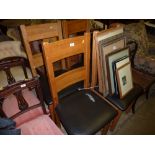A set of four oak bar back dining chairs