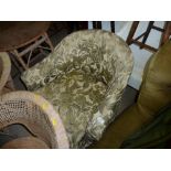 A floral upholstered tub chair