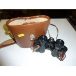 A pair of BBT Krauss binoculars in leather carryin