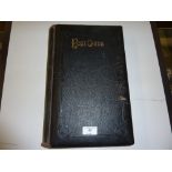 A large leather bound post-card album and contents