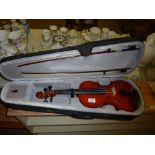 A violin and bow in fitted case