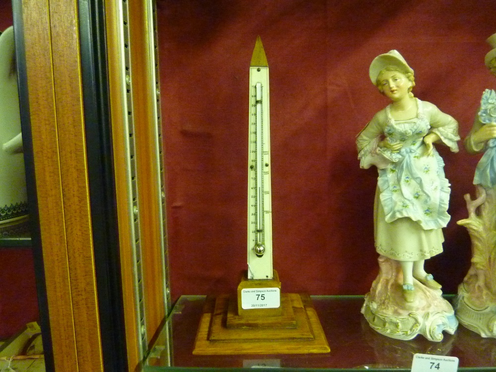 An olive wood thermometer