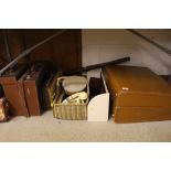 A vintage leather suitcase; various small suitcase