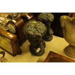 A pair of classical style bronzed busts