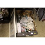 Two boxes containing dolls, ornaments, framed embr