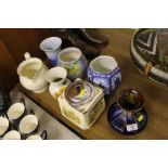 A Ringtons tea caddy; various pottery vases; Art D