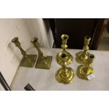 Three pairs of antique brass candlesticks