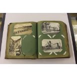 An early 20th Century postcard album and contents