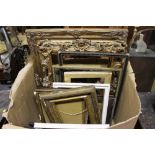 A box of various picture frames