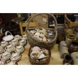 Two baskets containing a quantity of sea shells