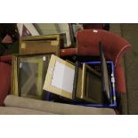 A quantity of various picture frames