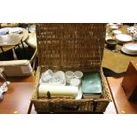 A wicker picnic set and contents