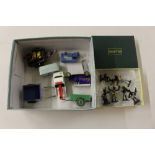 A box containing die cast metal vehicles and small