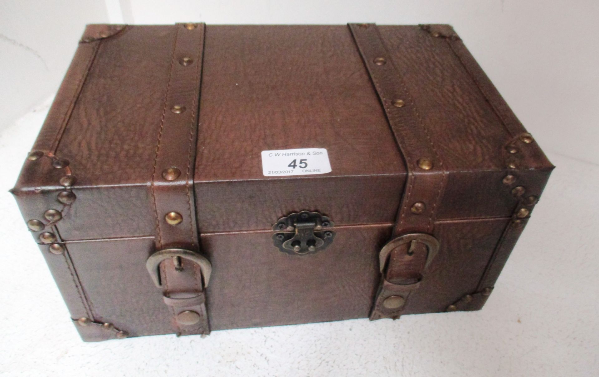 A small brown leather chest