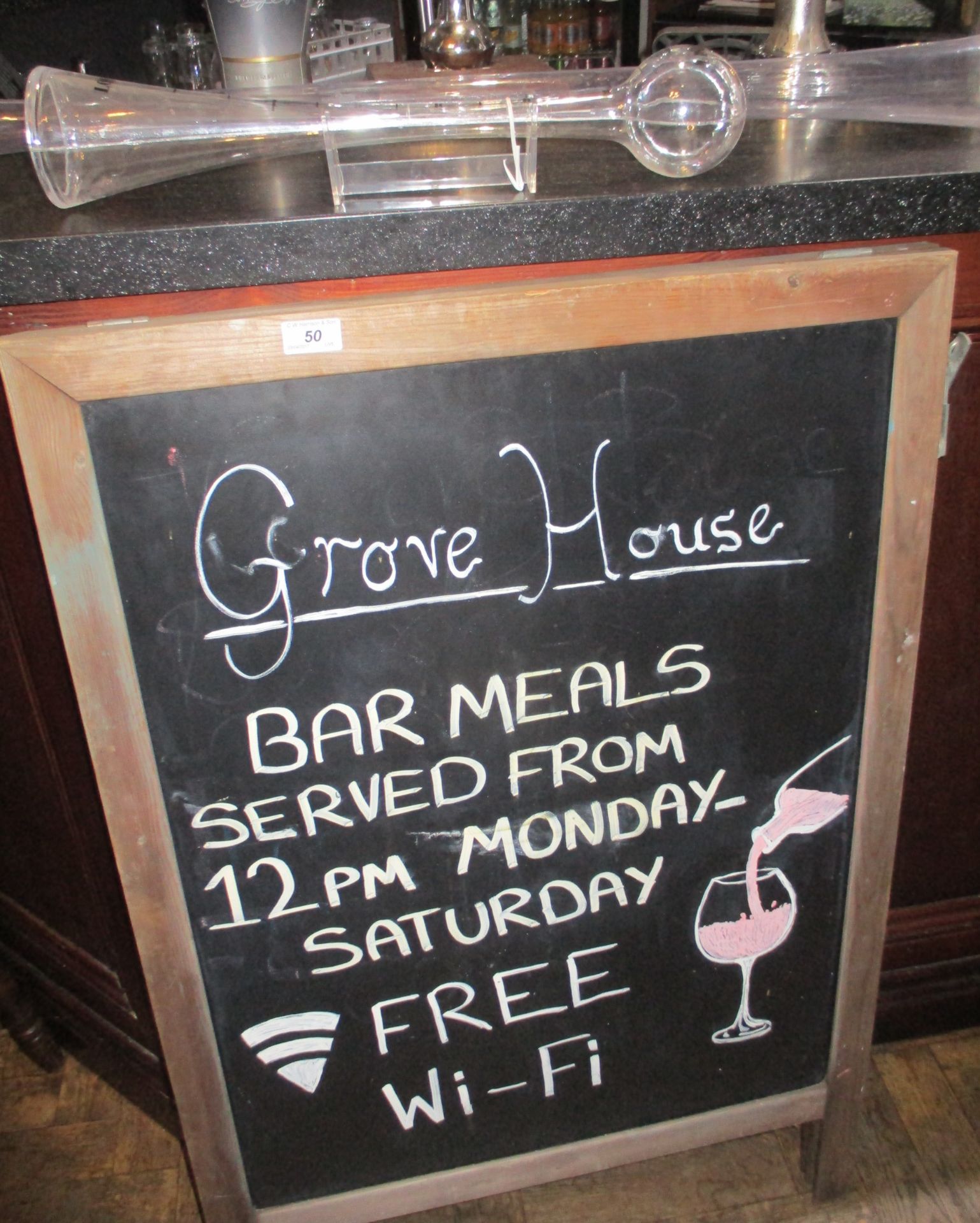 A framed chalk board and two plastic drinking funnels [yard of ale and half yard of ale] [3]