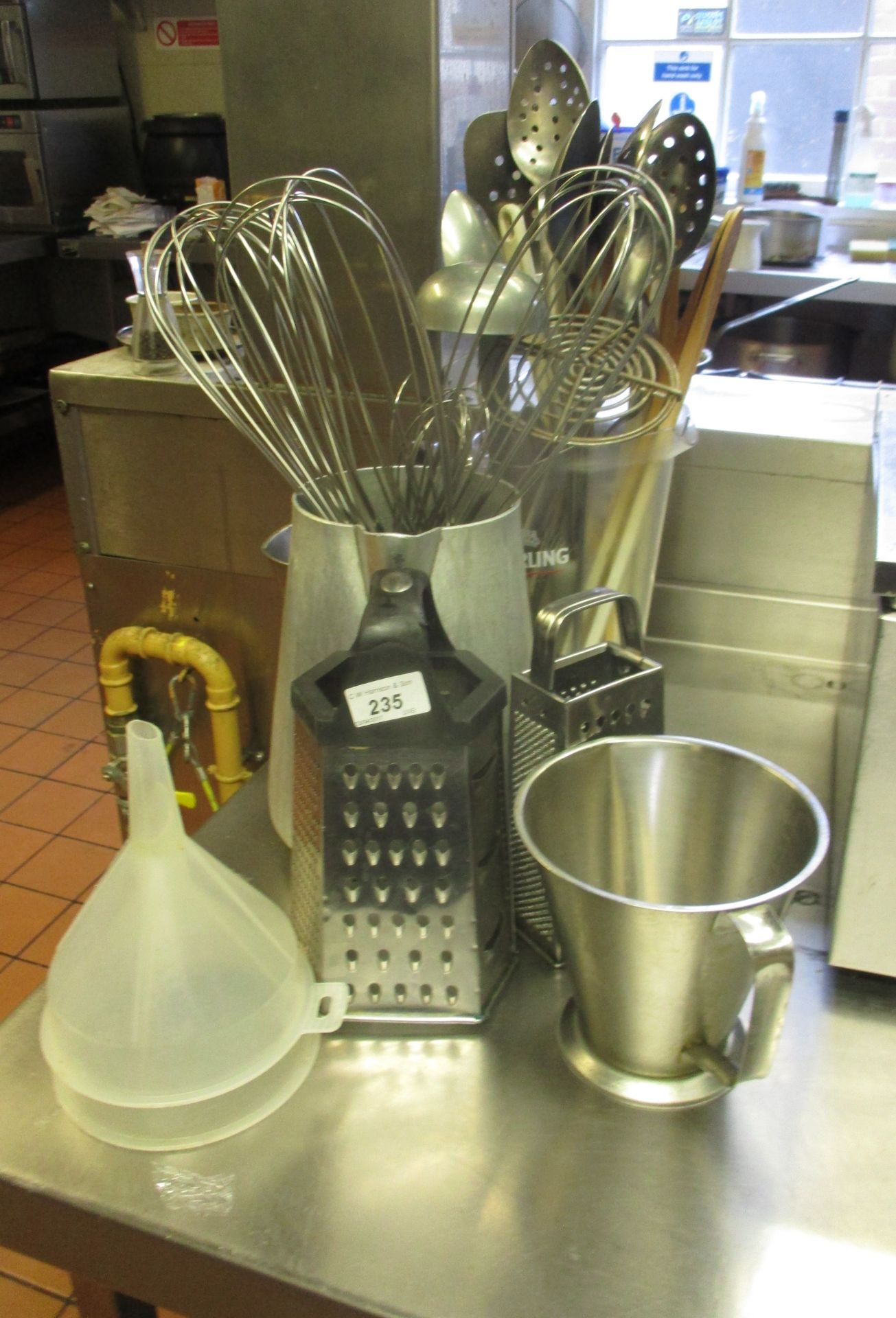 Small quantity of kitchen utensils - whisks, spoons, jugs, etc.