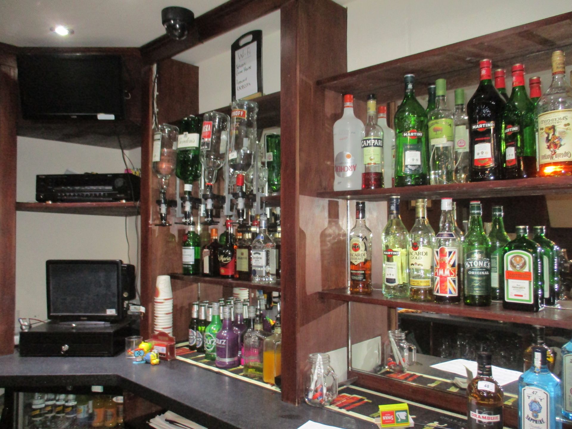 Contents to back of bar - 22 part bottles of spirits and liqueurs, Bacardi, various whiskies, vodka,