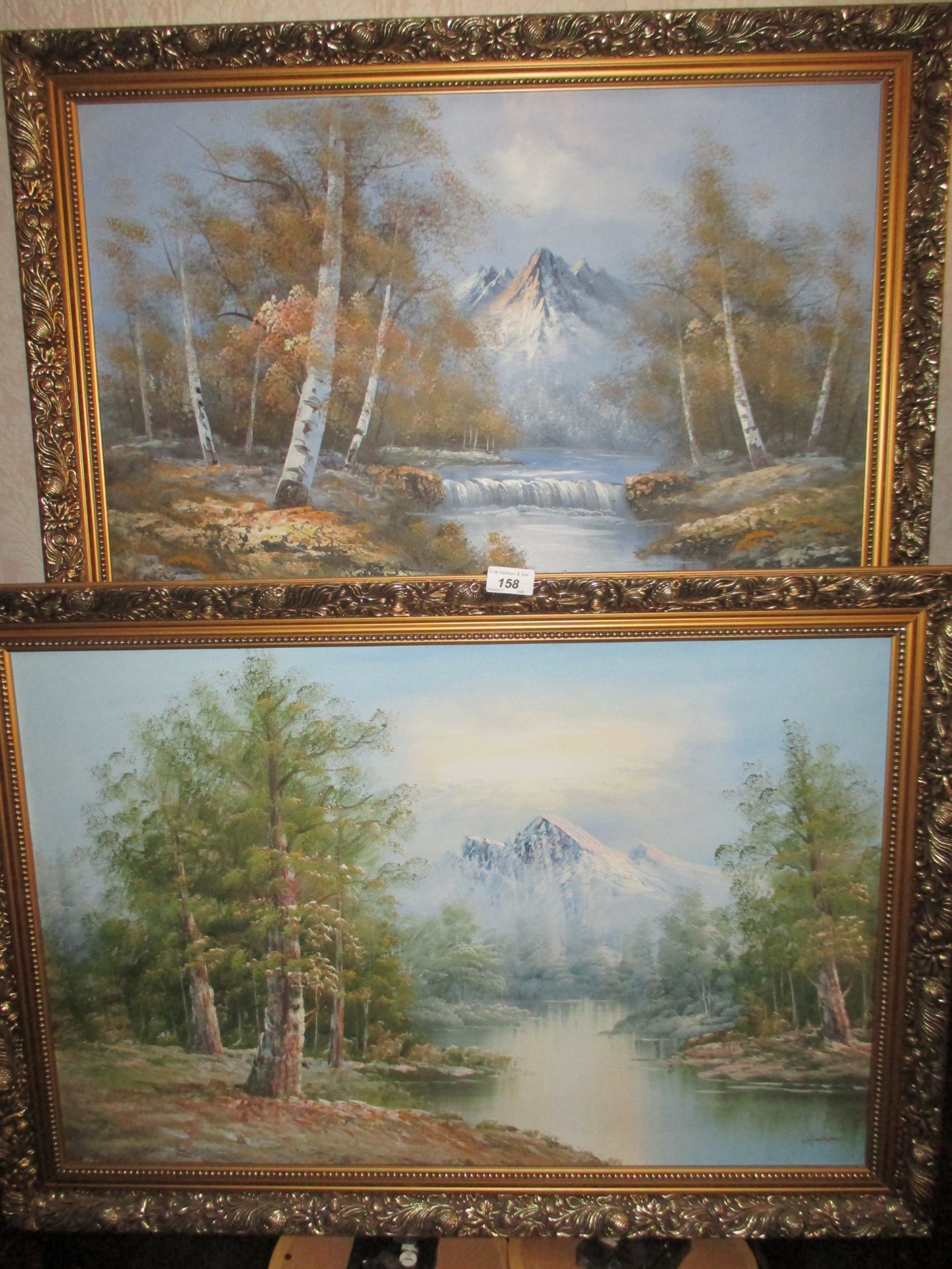 2 x gilt framed oils on board 'Rivers with mountain backdrops' each 50 x 70cm