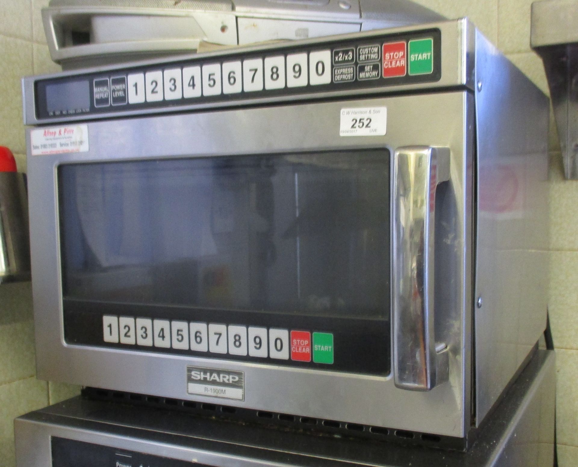 A Sharp stainless steel cased commercial microwave oven model R1900M - 240v.