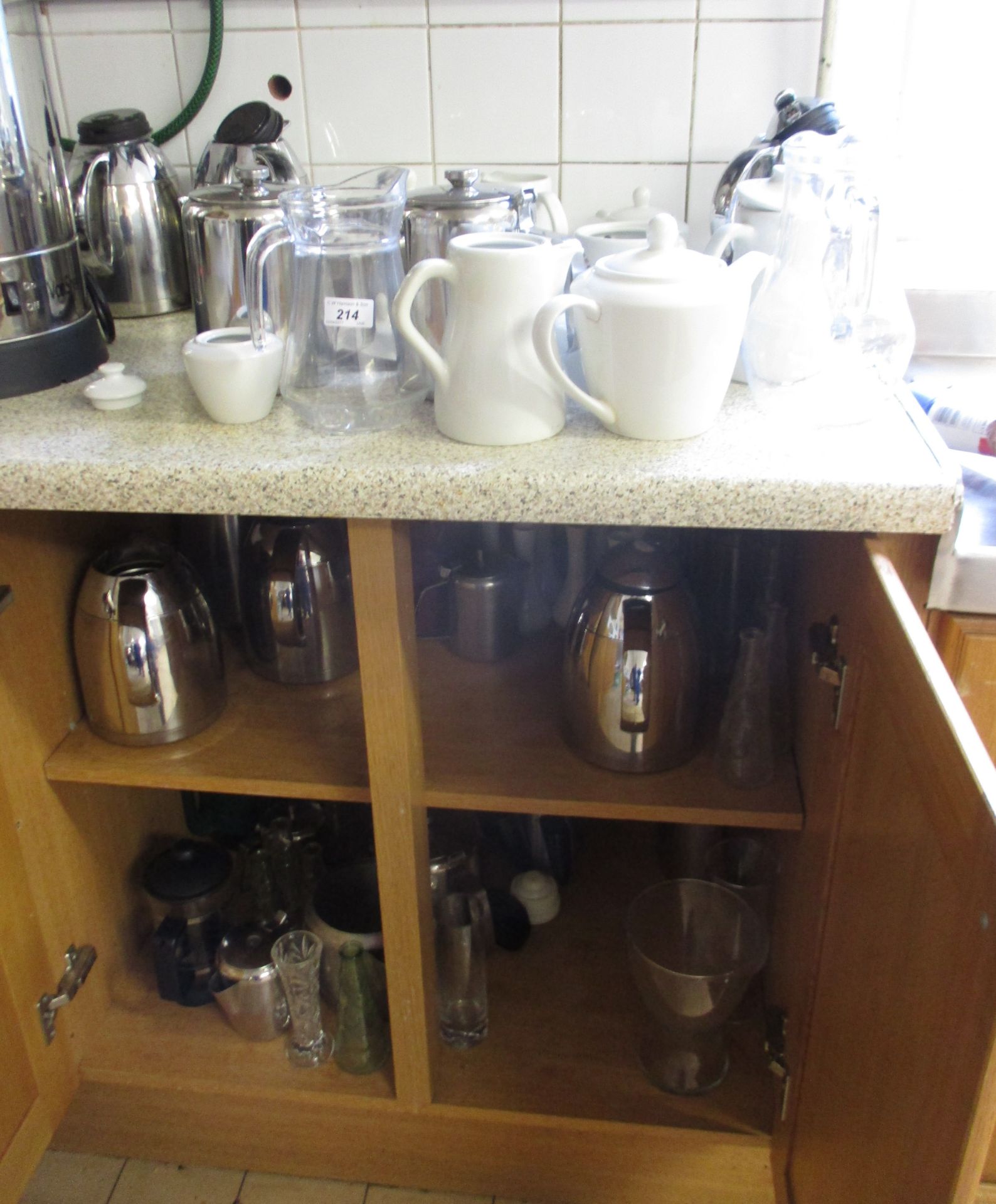 Contents to two base cupboards, part work surface and wall cupboard - stainless steel vacuum flasks,