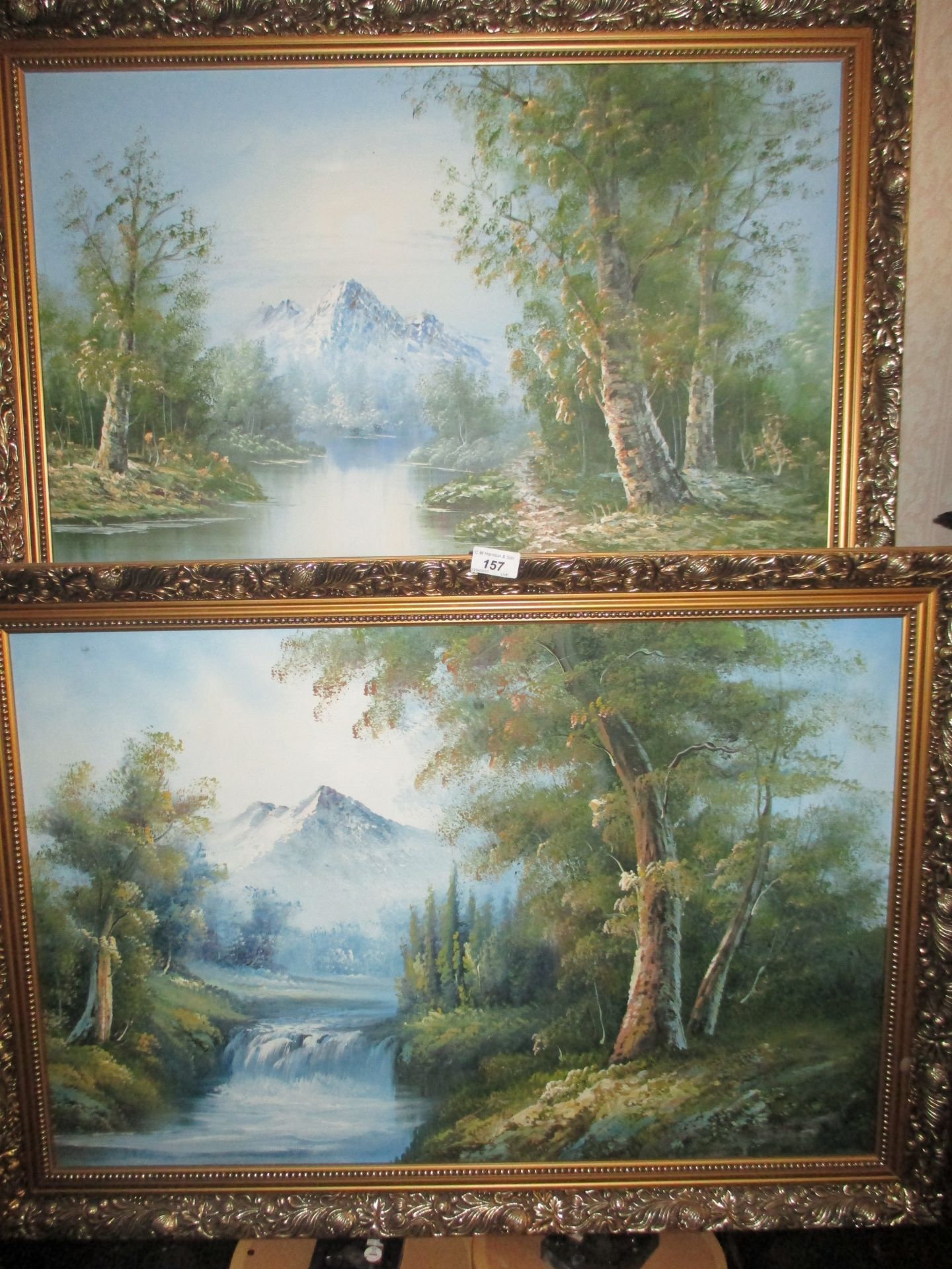 2 x gilt framed oils on board 'Rivers with mountain backdrops' each 50 x 70cm