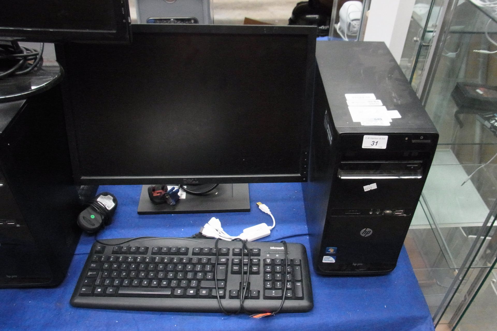 A HP Pro tower computer - power lead, complete with a Dell 22" LCD monitor - power lead,