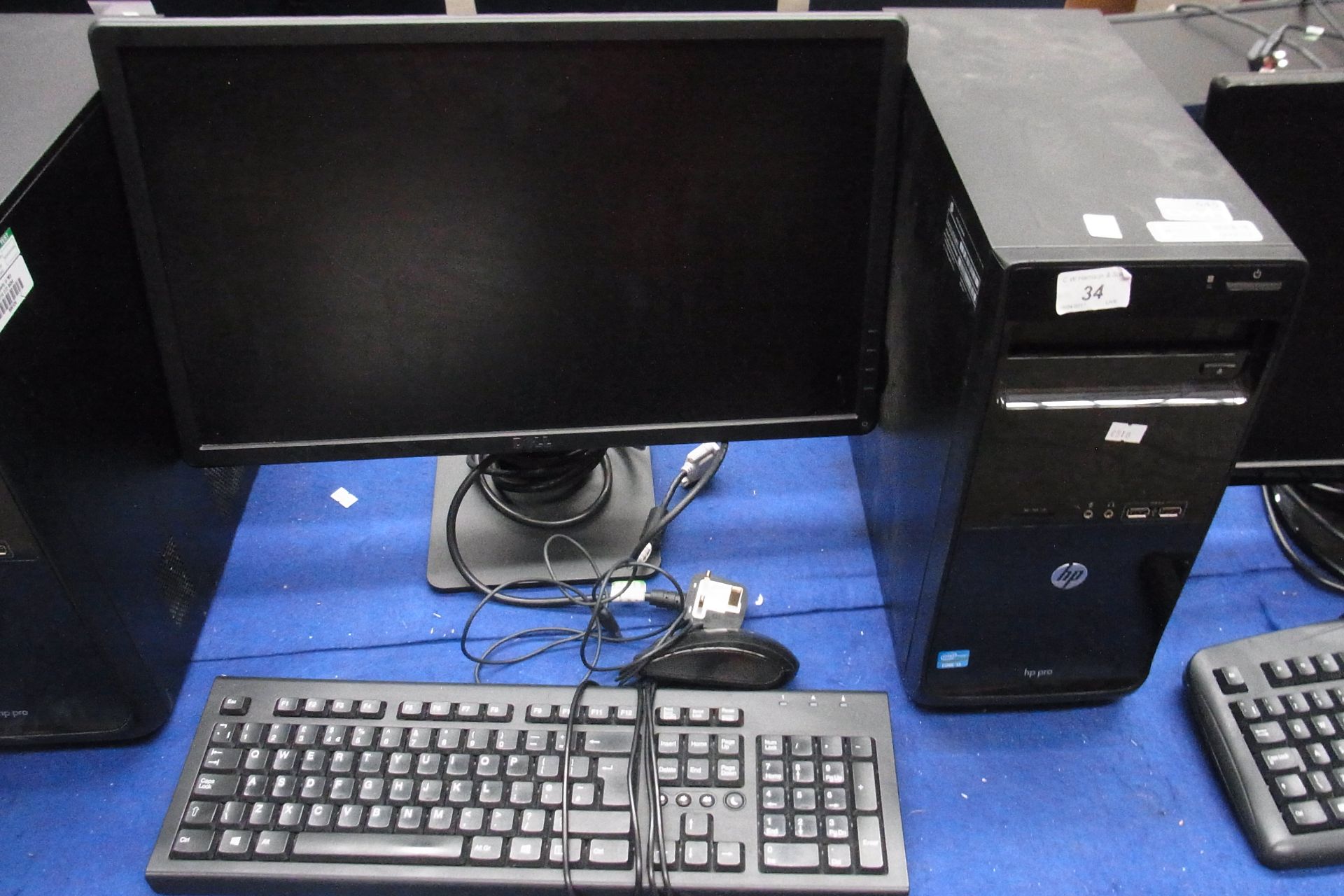 A HP Pro tower computer - power lead, complete with a Dell 22" LCD monitor - power lead,