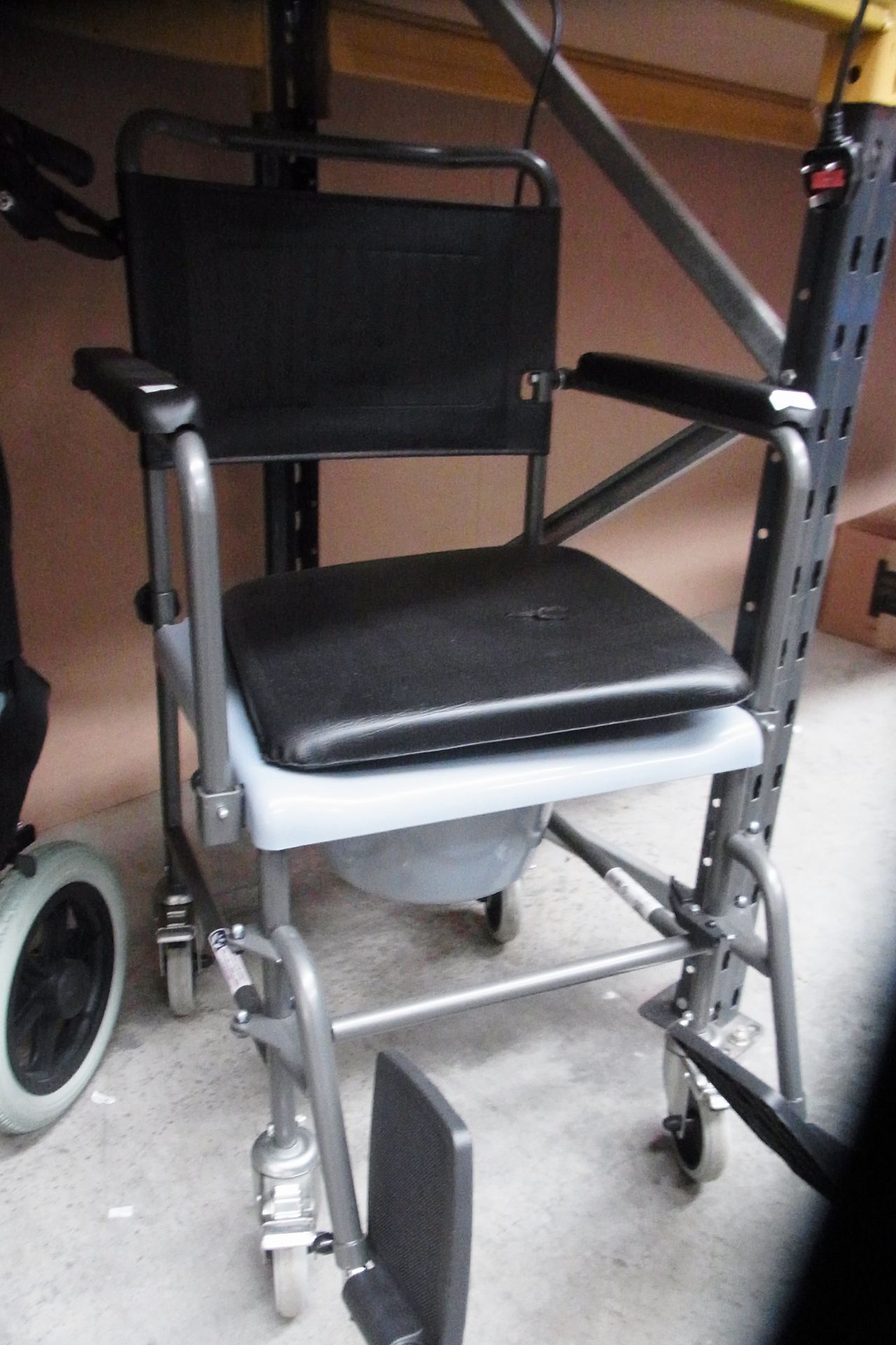 An Invacare four wheel mobility chair