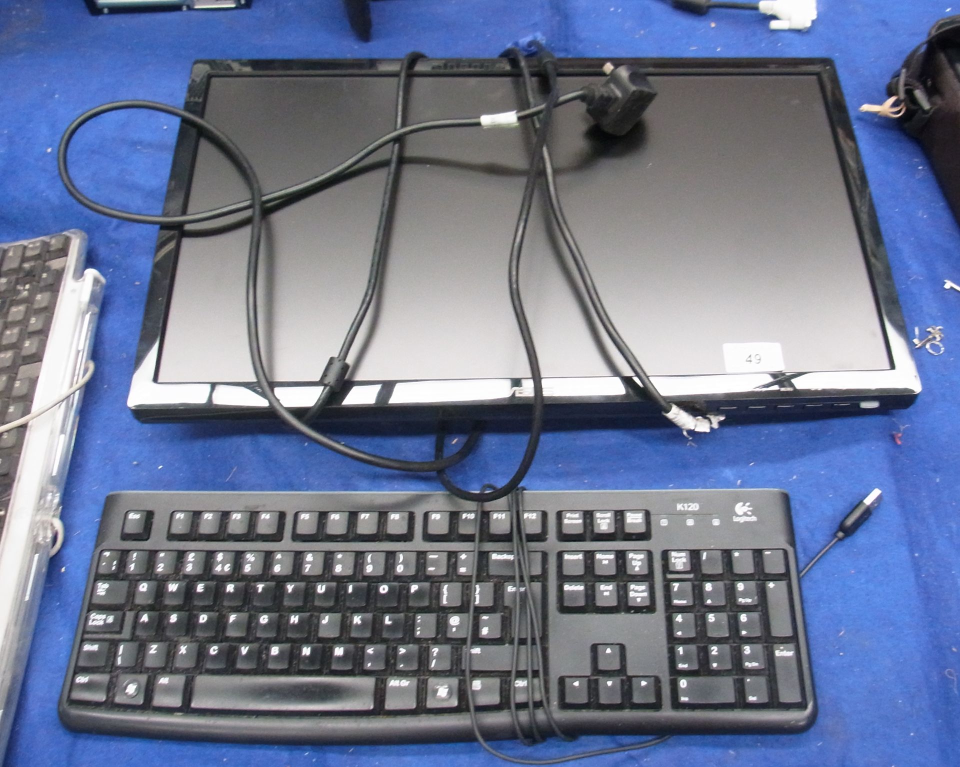 An Asus 22" LCD monitor (no stand) complete with a keyboard