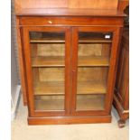 A mahogany 2 glazed door 3 shelf bookcase 115cm high