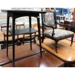 A small oak swivel top card table and an oak framed nursing chair with floral patterned upholstery