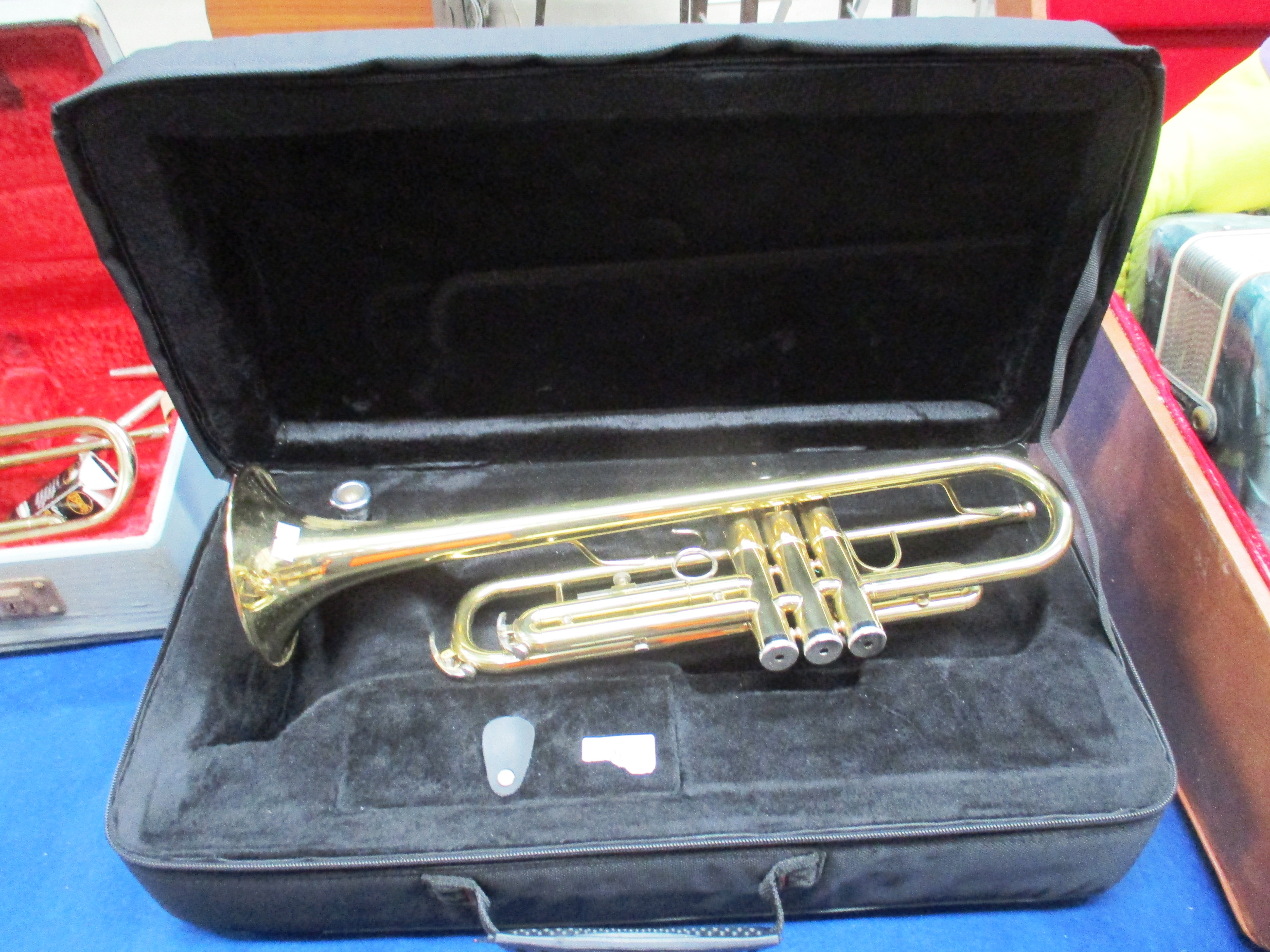 A Stagg 77-T universe of music brass trumpet in case complete with attachments