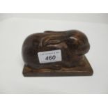 An oak paper weight carved as a rabbit, on rectangular base with Alan Granger,