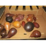 A collection of turned wood apples, pears and acorns,