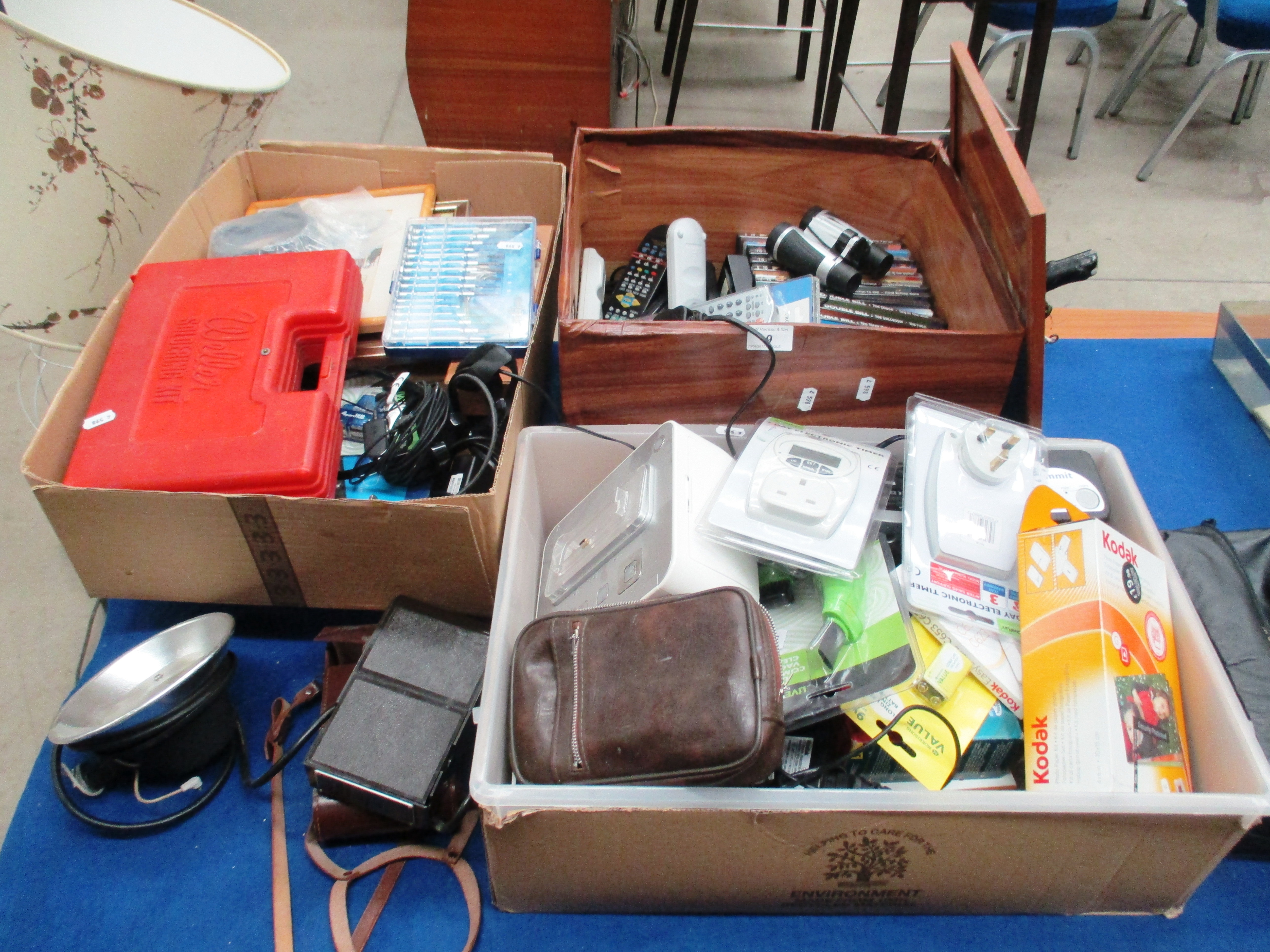 Contents to 3 trays - Braun Cebe 1 flash unit, quantity DVD's, small pair binoculars, sewing kit,