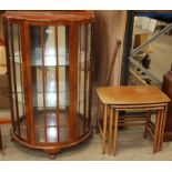 A Walnut bow front china cabinet 73cm and a Remploy nest of 3 teak coffee tables (2)